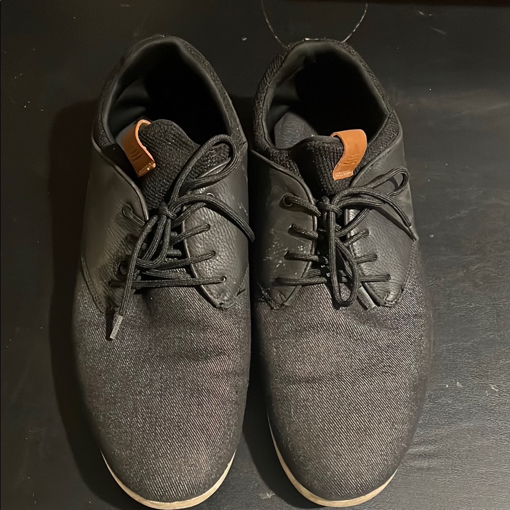 Stylish Black Sneakers with Tan Accents